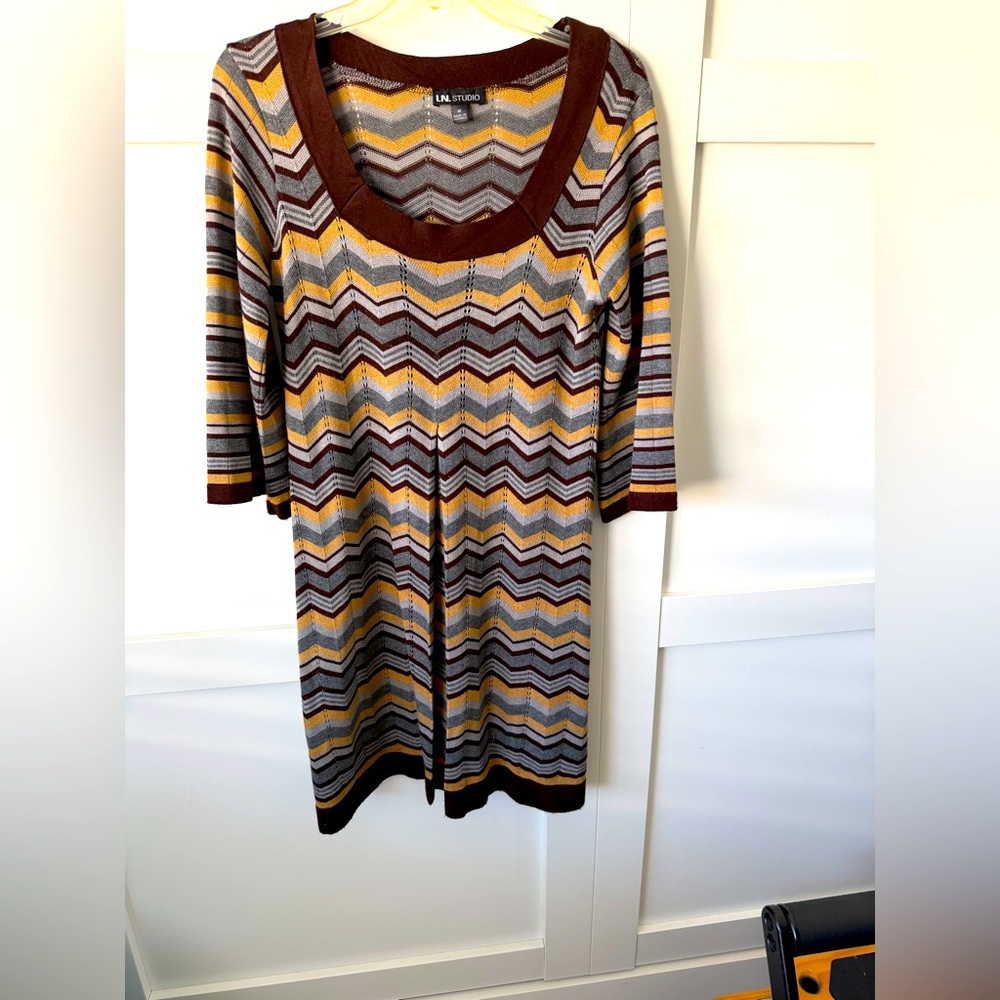 This dress is a nice knit dress with a front pleat.